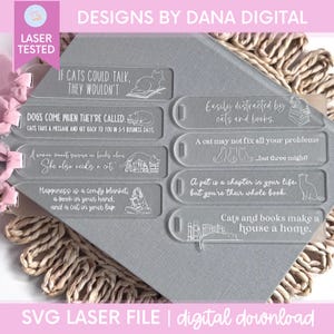 May include: Clear acrylic bookmarks with cat-themed quotes and illustrations. The bookmarks feature phrases like "If cats could talk, they wouldn't" and "Cats and books make a house a home." The design includes laser-cut details and the text "SVG Laser File | digital download."