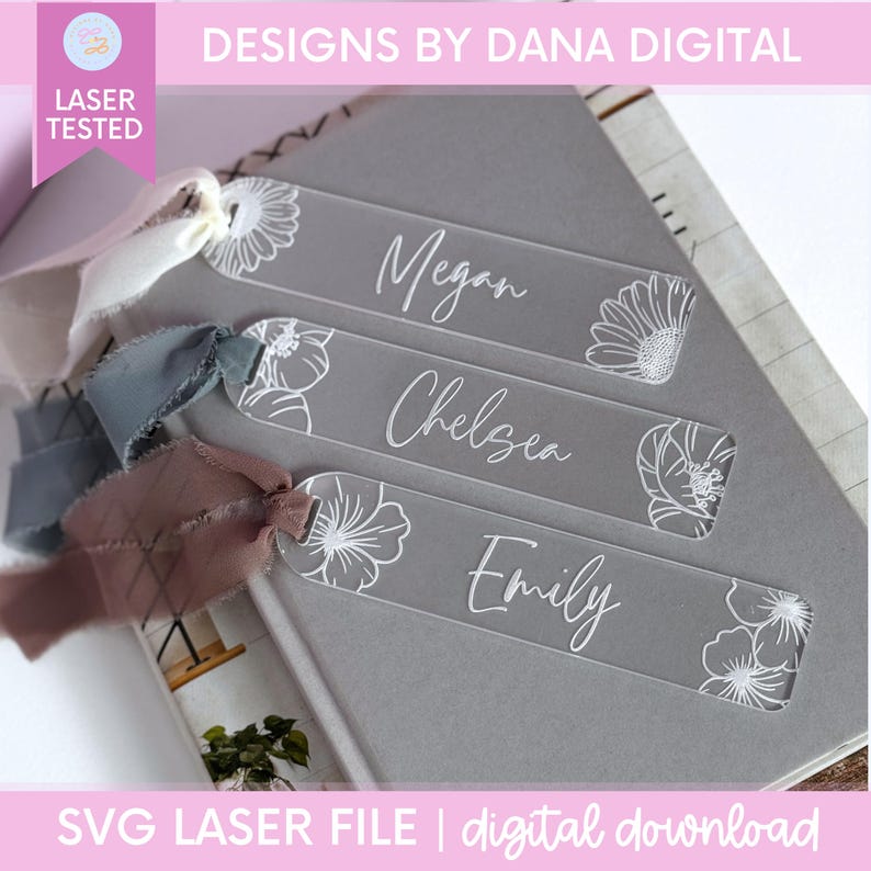 Clear acrylic bookmarks with white floral designs and personalized names: Megan, Chelsea, and Emily. Each bookmark has a ribbon attached. The text "DESIGNS BY DANA DIGITAL" and "SVG LASER FILE | digital download" are also visible.
Birth Month Flower Bookmark Svg File Digital Download Laser Cut Design Acrylic Bookmark Template Personalized Gift For Mom Mothers Day Present Custom Bridesmaid Keepsake Gift Grandma Birthday Gift Floral Design Svg Laser Cutting File