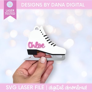 May include: A white ice skate ornament featuring black laces, a black heel, a silver blade, and the name Chloe in pink script lettering. The design includes a small circular hole at the top for hanging, presented as a digital laser file.