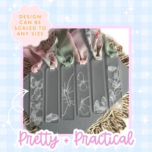 Clear acrylic bookmarks with white butterfly designs and colorful ribbons. The bookmarks have different butterfly illustrations. Text on the image reads "Design can be scaled to any size" and "Pretty + Practical".
DIY Bookmark Making SVG File Butterfly Design Digital Craft Pattern Laser Cutting File Acrylic Ready Glowforge XTool CO2 Compatible Instant Download Gift Creation File Bridesmaid Mothers Day Grandma Present Nature Inspired