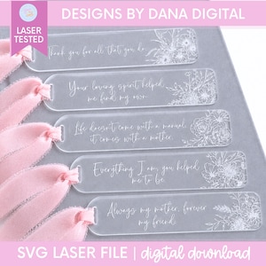 May include: Five clear rectangular acrylic bookmarks with rounded ends, each featuring white engraved floral illustrations and sentimental text. Each bookmark includes a soft, light pink frayed ribbon tied through a hole at the left end.