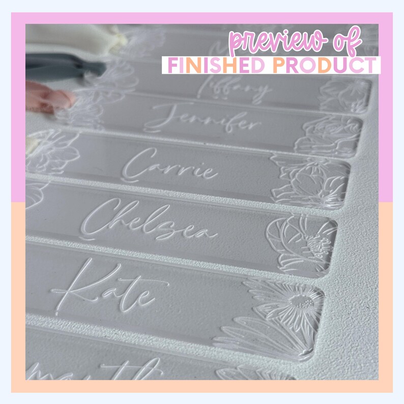 Clear acrylic name tags with floral designs and names like "Chelsea" and "Kate" in elegant script. The tags have a frosted appearance and are arranged in a row. The text "preview of finished product" is at the top.
Personalized Birth Flower Bookmark Svg Laser Cut File Digital Download Custom Acrylic Bookmark Design Mothers Day Gift For Mom Bridesmaid Keepsake Present Grandma Birthday Gift Floral Svg Template Laser Cutting Design Glowforge Xtool