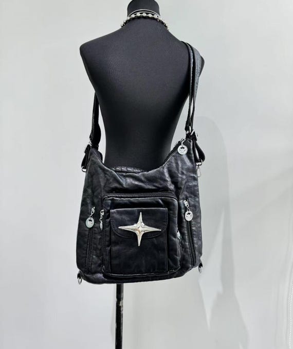 black leather backpack with metal Chikencall Skull Hooded Skull Gothic Rucksack Rivet Studded Zipper Shoulder Purse Punk 3D Stereo Daypack : Clothing, Shoes & Jewelry This leather roll top backpack uses a flexible upper section and crossed front straps to create a recognizable X Limited Jules Backpack Black with