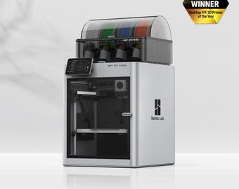 May include: A silver and black 3D printer with a clear plastic lid. The printer has a touch screen display and a filament spool holder. The printer is labeled "Bambu Lab" and "X1-Carbon".