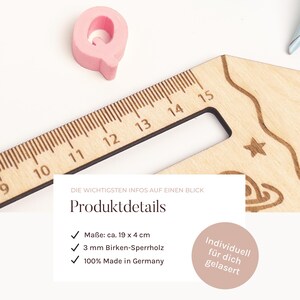 May include: A wooden ruler with etched markings and decorative shapes, measuring approximately 19 x 4 cm. A pink wooden letter "Q" is next to the ruler. The text on the image says "Product Details" and "100% Made in Germany".