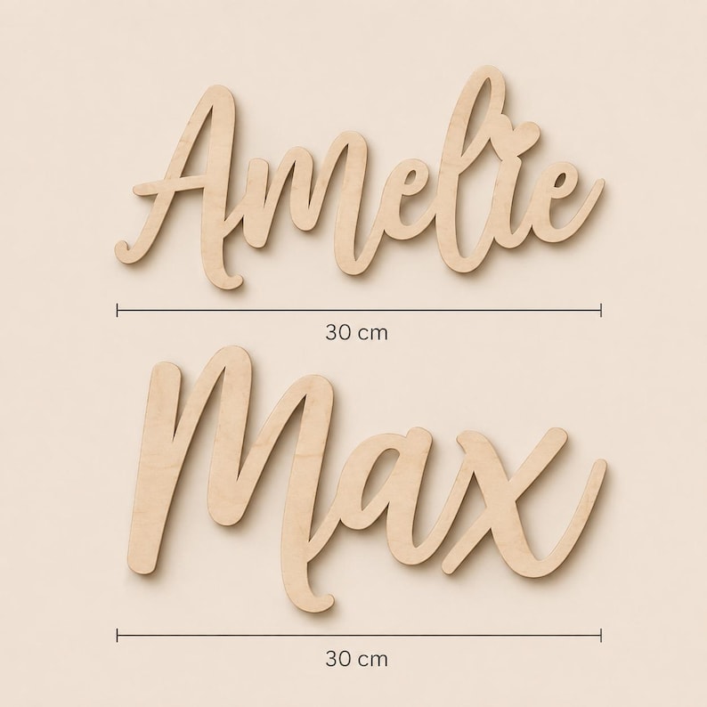 May include: Two wooden name signs, "Amelie" and "Max", in a cursive font. Each name is 30 cm long. The wood has a natural, light brown color. The names are displayed against a neutral background.