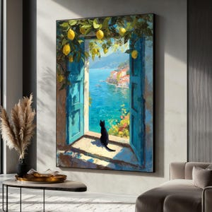 May include: A framed painting depicts a coastal scene with a black cat sitting in a blue window. The window opens to a vibrant blue sea and a village with colorful buildings. Lemon branches frame the top of the window, adding a touch of nature.