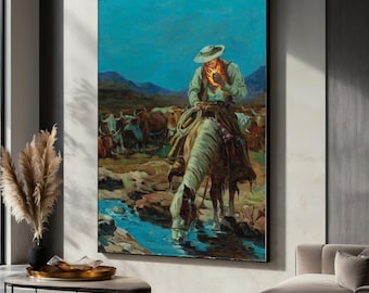 May include: A framed painting depicts a cowboy on horseback, with a herd of cattle in the background. The cowboy, wearing a hat and scarf, is positioned near a stream where his horse is drinking. The artwork features a blue sky and mountainous landscape.