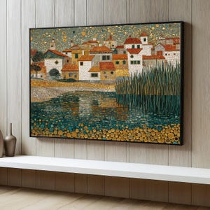 May include: A framed artwork depicting a village scene with red-tiled roofs, white buildings, and a body of water. The artwork has a mosaic-like appearance with a black frame. The water features green and gold circular patterns.