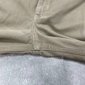 May include: A set of three ceramic mugs with a speckled, matte finish. The mugs are in shades of cream, light gray, and dark gray. Each mug has a simple, minimalist design and a rounded handle.