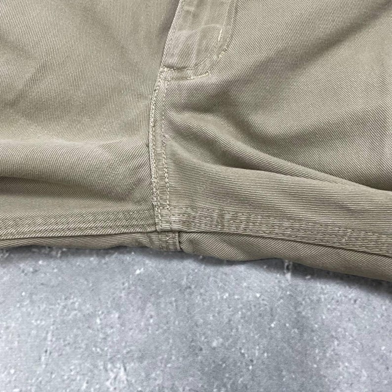 May include: A set of three ceramic mugs with a speckled, matte finish. The mugs are in shades of cream, light gray, and dark gray. Each mug has a simple, minimalist design and a rounded handle.