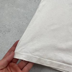 May include: A rustic wooden sign with the text "Welcome to our home" in white lettering. The sign features a distressed finish and a simple, inviting design, perfect for a front porch or entryway.