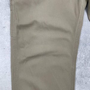 May include: A set of three ceramic mugs with a speckled, matte finish. Each mug features a different color: light blue, cream, and gray. The mugs have a simple, modern design and a comfortable handle.