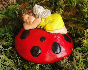 Whimsical Fairy sleeping on top of a Big Red Mushroom top. Fairy Garden Decor - size 4 inches circular.