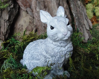 A very cute and well detailed Rabbit or bunny for garden or use for a pet memorial. White with black eyes.