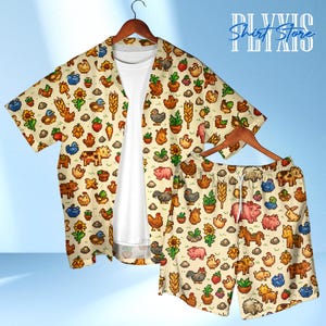 May include: A two-piece pajama set featuring a button-down shirt and shorts. The set is beige and covered in a pixelated farm animal and plant pattern. The shirt has short sleeves and a white undershirt. The text "Shirt Store" is visible.
