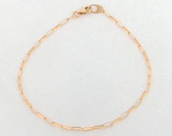 Pulsera de cadena con clip de oro macizo de 14 quilates: cadena de eslabones ovalados, delicada, no hueca.