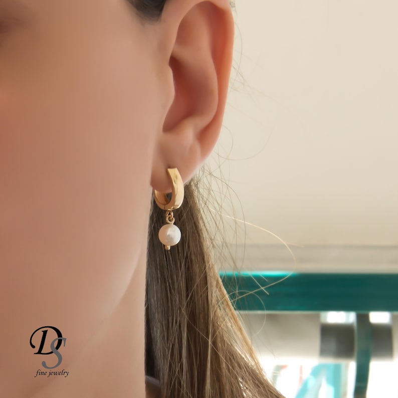 Solid gold hanging pearl hoop earrings