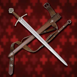 May include: A medieval sword with a silver blade and a brown leather handle and sheath. The sword has a cross-shaped hilt and is accompanied by a matching leather scabbard and belt, adorned with silver crosses. The background is a red pattern.