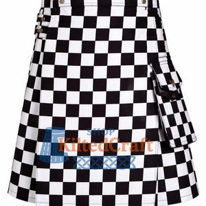 May include: A black and white checkered kilt with a matching pocket. The kilt has silver hardware and a pleated design. The text "Shop Kilted Craft" is printed on the front.