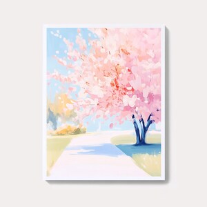 Puede incluir: Impresión artística enmarcada que representa un paisaje. Un gran árbol de flores rosas domina la escena, con un cielo azul de fondo. Un camino blanco serpentea a través de una zona de césped, creando una composición serena y colorida.