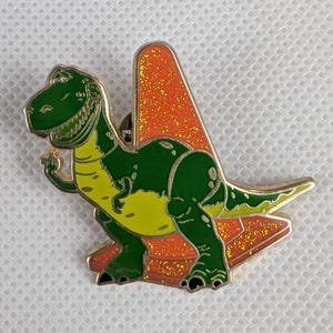 Disney Pixar Toy Story Rex Enamel Pin – Green Dinosaur with Glitter Cone | Collectible Metal Lapel Pin for Fans, Gifts, or Accessories.