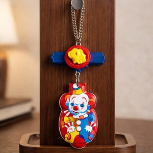 Vintage Clicker Clown Necklace: Whimsical Circus Tin Toy Pendant