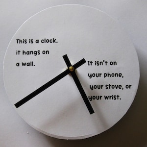 Small wall clock. Clock w amusing message. Bl and wh clock. 7 in clock. Clock with words. Recycled vinyl record.
