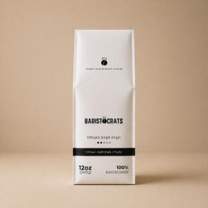 May include: A white coffee bag with the text "BARISTOCRATS" and "Ethiopia Single Origin." The bag also states "Citrus / Light Body / Fruity" and contains 340g of 100% roasted coffee. The bag has a crown logo and the phrase "WHERE THE BEAN REIGNS SUPREME."