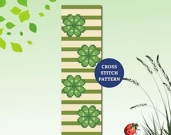 May include: A cross-stitch pattern bookmark featuring four green shamrocks and horizontal green stripes on a cream background. The text "CROSS STITCH PATTERN" is on a blue circle. The bookmark is a vertical rectangle.