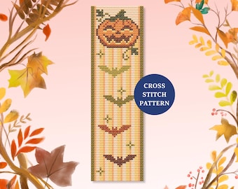 May include: A cross-stitch pattern featuring a pumpkin and bats on a striped background. The design includes the text "CROSS STITCH PATTERN" in a blue circle. The color palette includes orange, green, and brown.