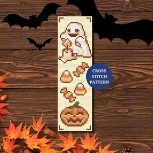 May include: A cross-stitch pattern with Halloween motifs. The design includes a ghost with a candle, candy corn, sweets, and a pumpkin. The words "CROSS STITCH PATTERN" are in a blue circle.