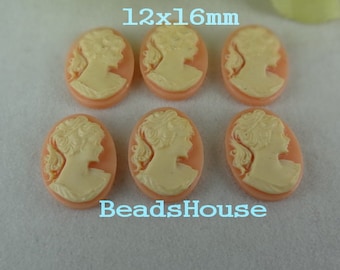 May include: Six peach-colored cameo-style resin cabochons with a white cameo design of a woman's profile. Each cabochon measures 12x16mm. The text "BeadsHouse" is printed below the cabochons.