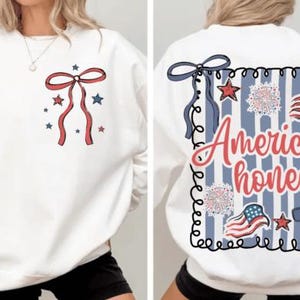 May include: White sweatshirt with a red bow and stars design on the front. The back features a blue and white striped design with the words "American honey", along with stars, bows, and American flags. A patriotic themed apparel item.