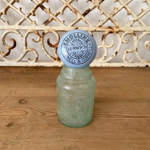 Antique Emolline pot lid with glass bottle