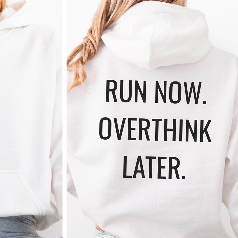 May include: White hooded sweatshirt with the text "RUN NOW. OVERTHINK LATER." in black block letters. The sweatshirt has a front pocket and a drawstring hood. The image shows the back of the sweatshirt.