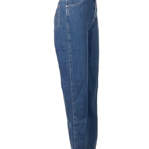 May include: Blue denim jeans with a classic five-pocket design. The jeans have a straight leg cut and a medium wash. The waistline is high-rise. The jeans are displayed on a white mannequin. The overall style is casual and versatile.