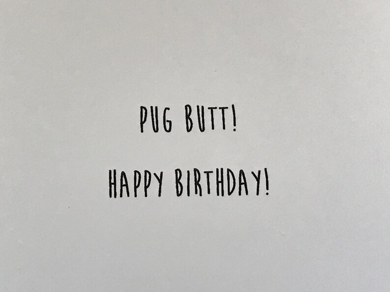 May include: A white card with black text that says "Pug Butt! Happy Birthday!"