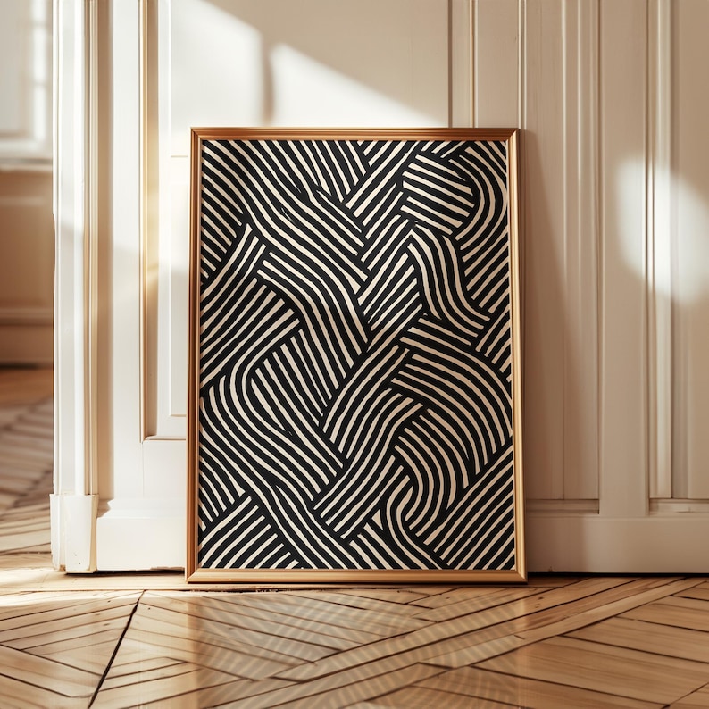Black and white abstract line art poster featuring bold geometric striped patterns woven into a modern minimalist design on a beige background.