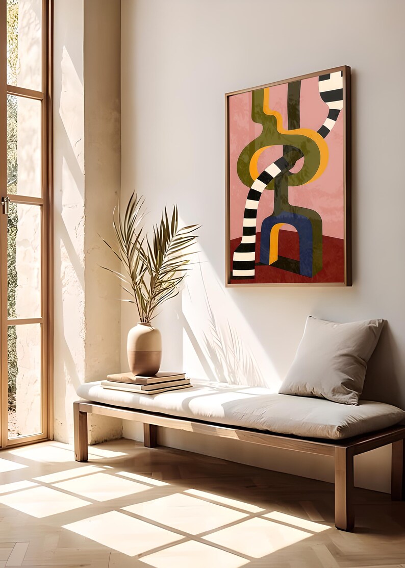 Contemporary abstract artwork featuring bold interlocking geometric shapes in olive green, gold, navy, and black-and-white stripes on a pink and red background.