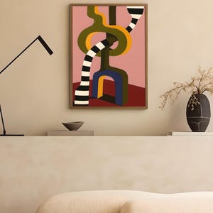 Contemporary abstract artwork featuring bold interlocking geometric shapes in olive green, gold, navy, and black-and-white stripes on a pink and red background.