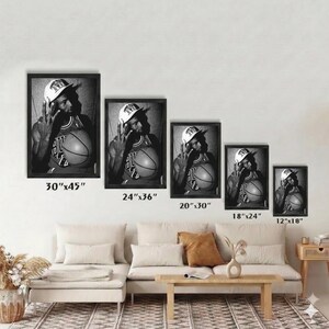 a series of framed black and white photographs of a person holding a basketball, arranged in a row on a wall.