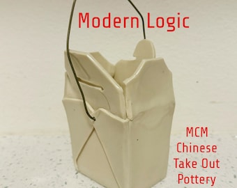 May include: A white ceramic take-out container with a wire handle. The container is shaped like a traditional Chinese take-out box. The text "Modern Logic" is written above the container. The text "MCM Chinese Take Out Pottery Vessel" is written below the container.