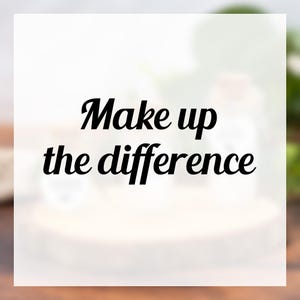 May include: A white square featuring the phrase "Make up the difference" in a stylish black font. The background is blurred, with soft green and brown tones, creating a subtle, natural backdrop.