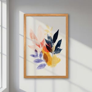Póster abstracto enmarcado, tonos pastel de azul, amarillo y hojas rosas, arte natural moderno, decoración colorida y única, estética vibrante de mediados de siglo.