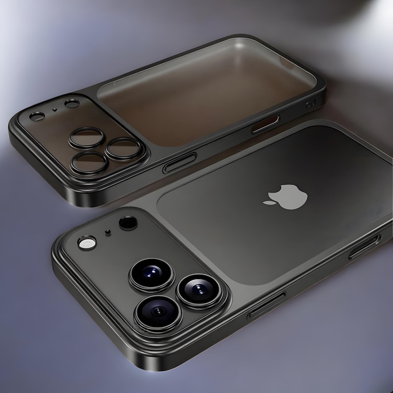 May include: Two black phone cases with a transparent back and camera lens cutouts. One case is positioned above the other, showcasing the design. The Apple logo is visible on the back of one case.