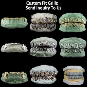 May include: An assortment of custom-fit grillz in various designs and colors, displayed on dental molds. The grillz feature gold, silver, and diamond-like embellishments. The text "Custom Fit Grillz Send Inquiry To Us" is at the top.