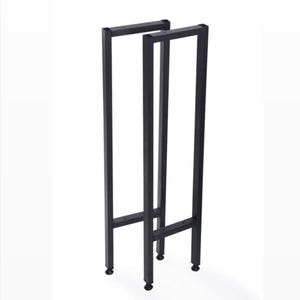 May include: Two black metal table legs with a rectangular frame design. Each leg has a vertical support and a horizontal top piece, connected by a lower crossbar. The legs have small, round feet.
