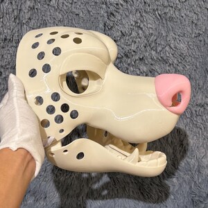 Movable jaw K9 fursuit head base for anthro and furry costume making. 3D printed from lightweight, durable PLA, featuring a stylized wolf skull shape with cartoon influences. Ideal for DIY makers creating Halloween costumes, Final Fantasy-inspired characters, or kemono-themed cosplay. Customizable and comfortable for extended wear.
