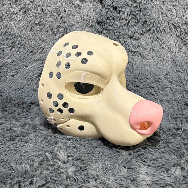Custom K9 fursuit head base with a stylized wolf skull design and movable jaw mechanism that opens and closes for expressive cosplay performance. Made from high-quality PLA, it's lightweight, durable, and easy to customize with fur, paint, or foam. Ideal for anthro character builds, kemono cosplay, Halloween costumes, conventions, or DIY gift projects for furry enthusiasts.